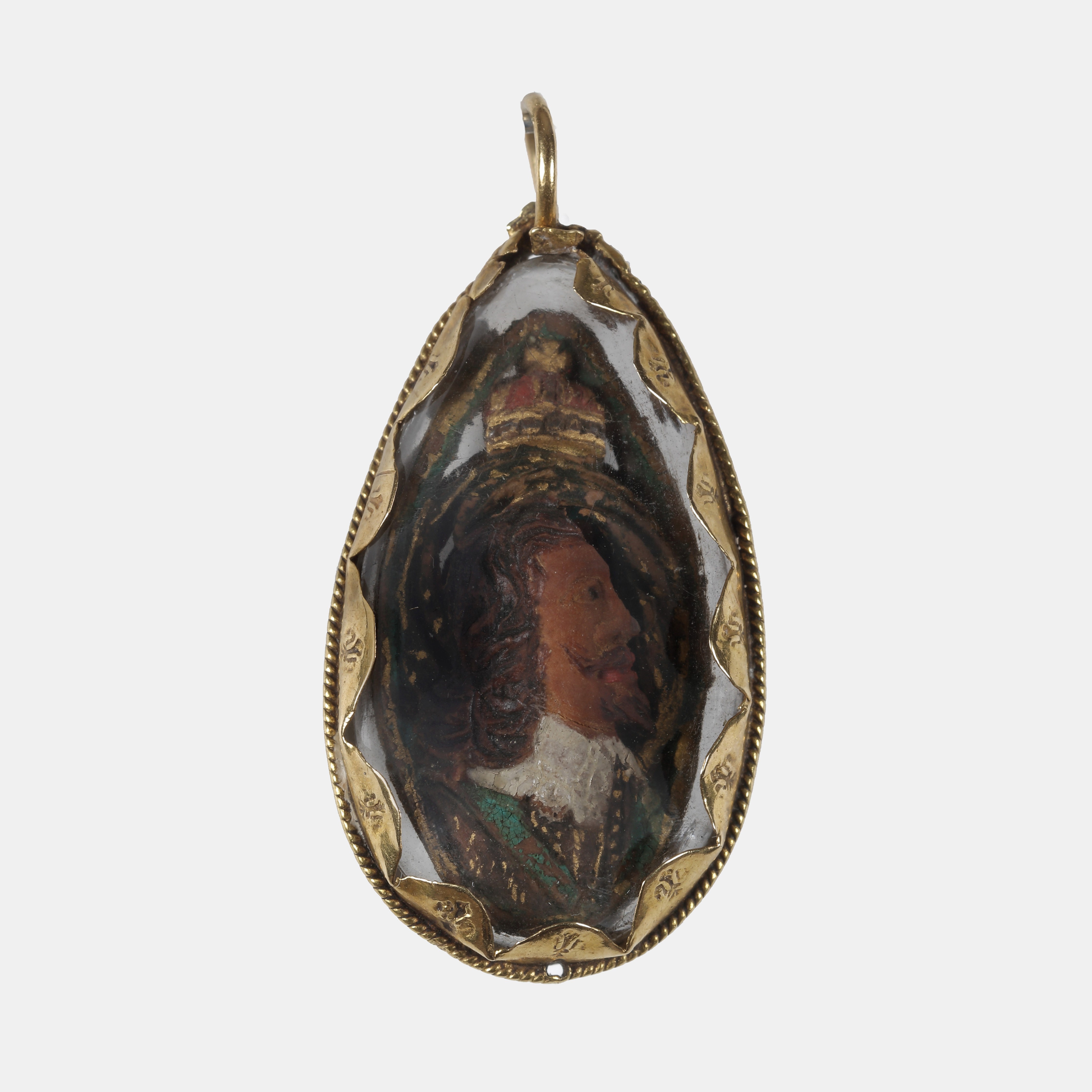 A fruit stone (probably a plum or peach stone) carved on both sides with portraits of King Charles I and King Charles II, with royal insignia